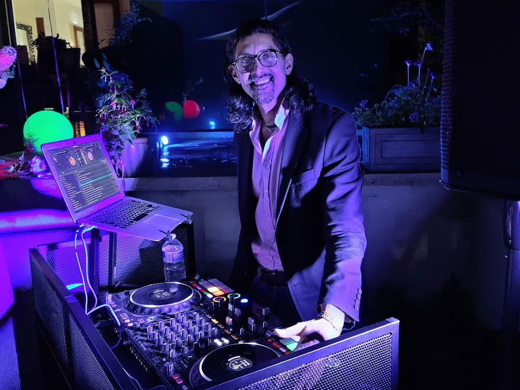DJ SR at a private rooftop garden event in London
